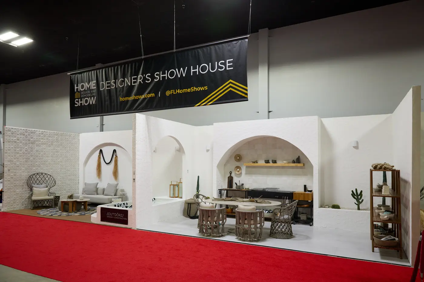 Designer show-house booth with arched alcoves and designer furniture