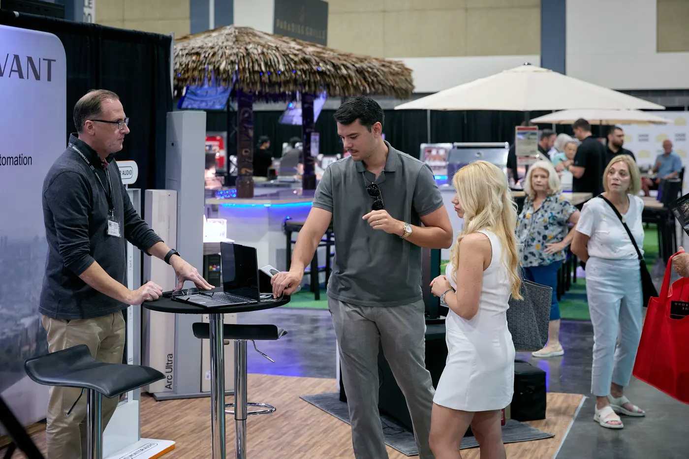 Exhibitor demonstrating smart-home automation at a Savant booth