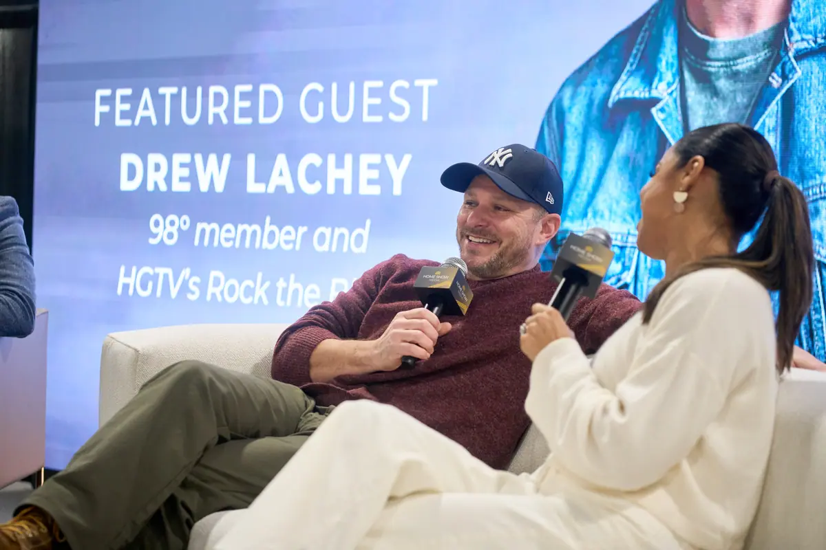 Drew Lachey, HGTV Rock the Block star, speaks with host on the Home Design Stage with his Featured Guest screen behind him