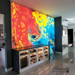 Bold red and blue abstract resin art panels covering kitchen cabinetry doors