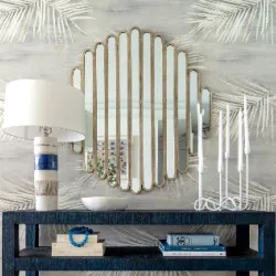 Console table vignette with Art Deco scalloped mirror, lamp, and candlesticks