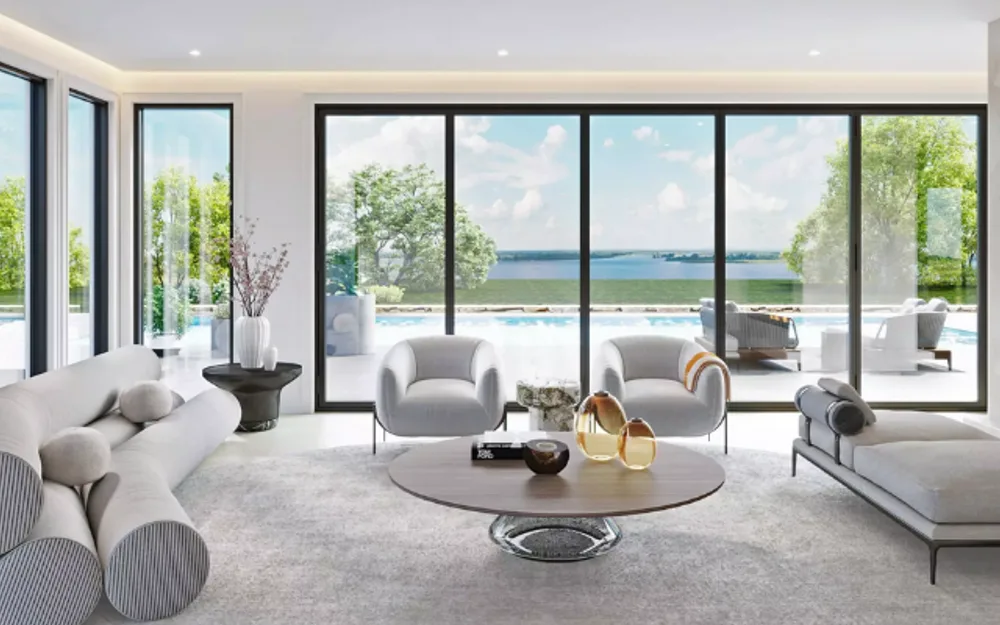 Open-plan luxury living room with floor-to-ceiling glass walls, pool view, and sculptural furniture