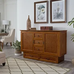 Oak-finish murphy cabinet chest with two doors and four drawers in a traditional living room