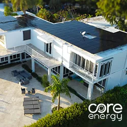 Aerial view of solar panels on multi-level Florida home roof with pool and tropical landscaping, Core Energy