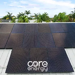 Close-up of black solar panel cells on a rooftop with Core Energy logo overlay
