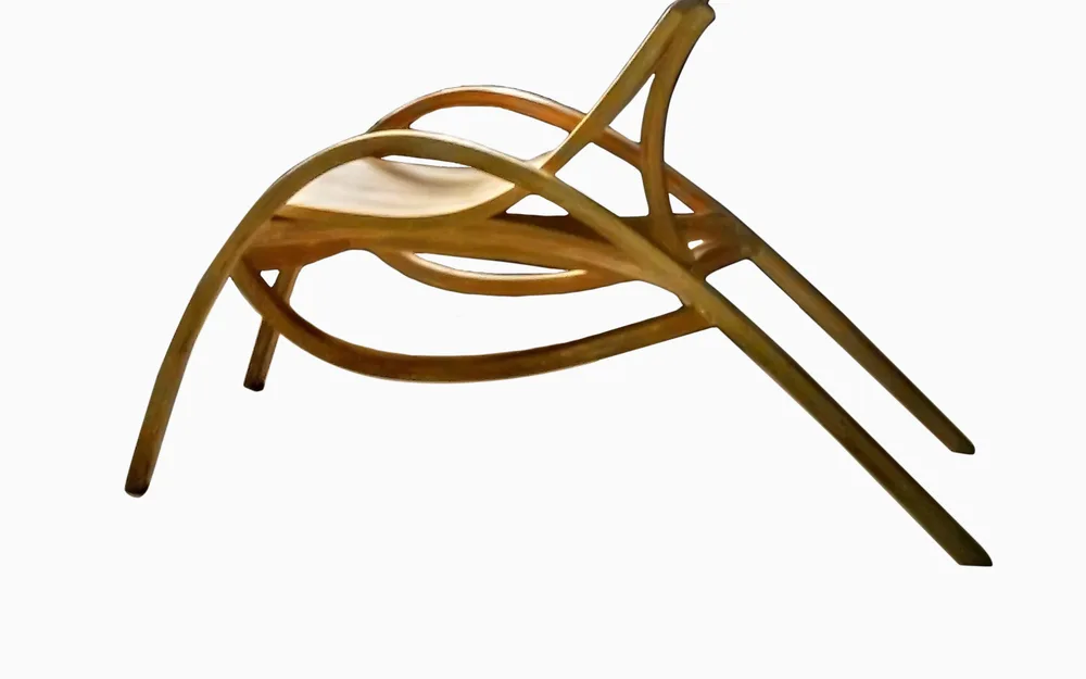Sculptural bentwood lounge chair with flowing curved natural wood frame