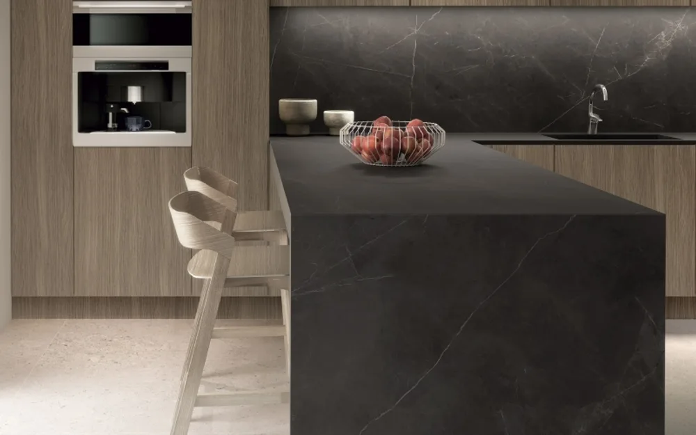 Dark marble-look porcelain island and backsplash in modern kitchen setting