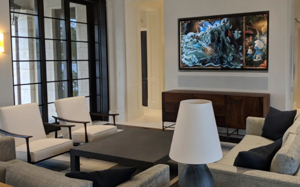 Smart home AV setup: wall-mounted TV over wood sideboard in elegant living room