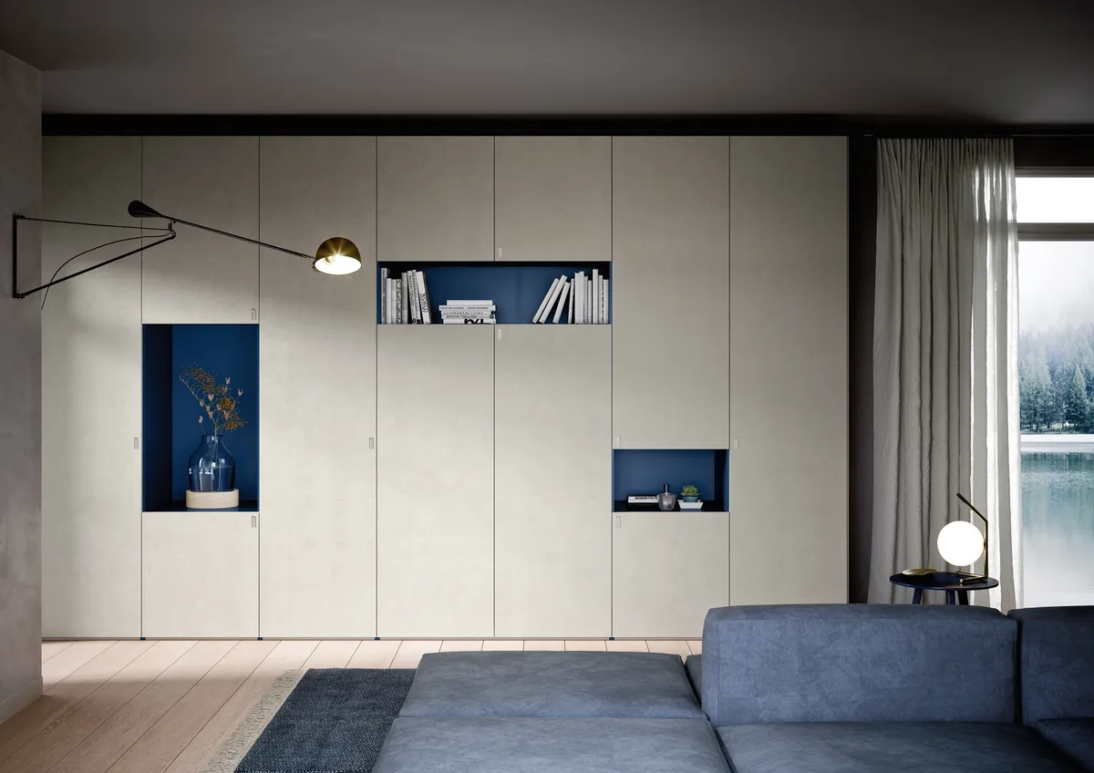 Large walk-in closet with glass sliding doors, dark wood shelving, and center island dresser
