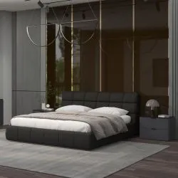 Contemporary dark gray upholstered platform bed with matching nightstands in a moody bedroom
