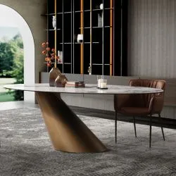 Oval marble-top dining table with curved gold pedestal base and a leather chair
