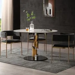 Round white marble dining table with gold cylinder pedestal and dark velvet chairs